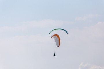 Paraplaners with beautiful blue sky and clounds in the background