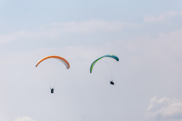 Paraplaners with beautiful blue sky and clounds in the background
