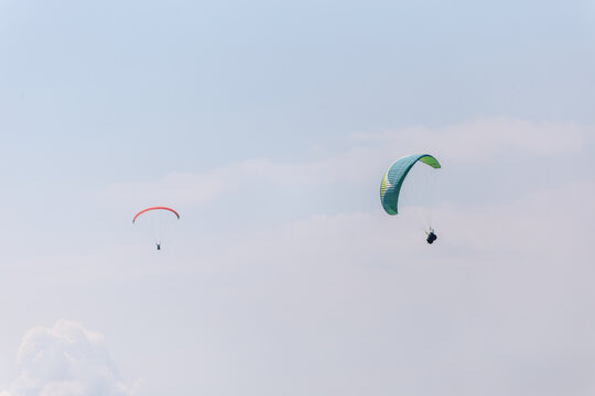 Paraplaners with beautiful blue sky and clounds in the background