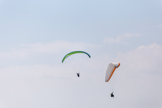 Paraplaners with beautiful blue sky and clounds in the background
