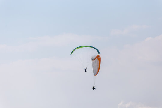 Paraplaners with beautiful blue sky and clounds in the background