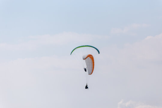Paraplaners with beautiful blue sky and clounds in the background