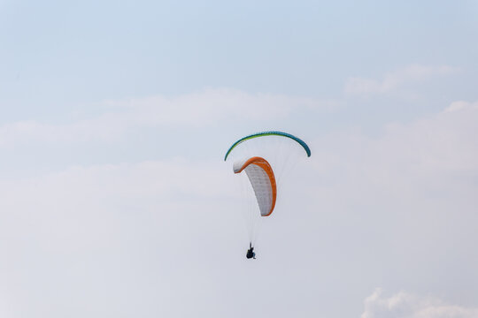 Paraplaners with beautiful blue sky and clounds in the background