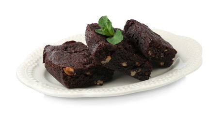 Delicious brownies with nuts and mint on white background