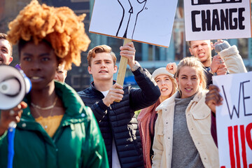 Protestors With Placards And Megaphone On Black Lives Matter Demonstration March Against Racism