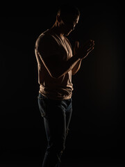 Fototapeta premium Perfect silhouette of a guy posing in studio