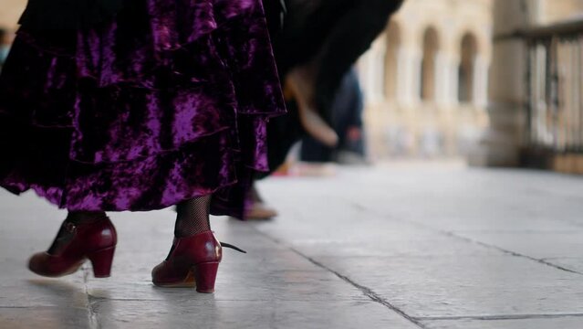 flamenco dancer in the street, female flamenco artists dancing in Seville, feet of street flamenco dancers in Andalusia, Spain