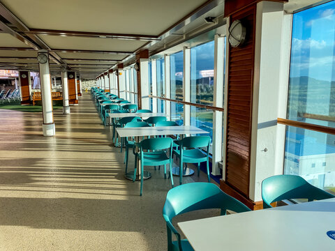 Emerald Princess Cruise Ship. Oceanfront Tables And Chairs On The Lido Deck. Empty With No People. 