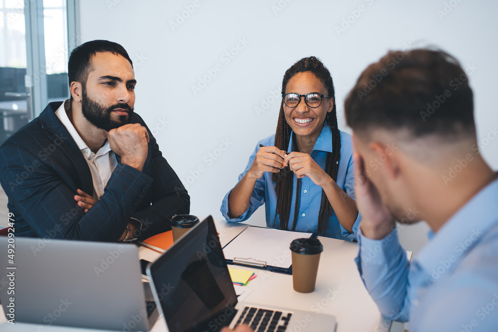 Aufkleber portrait of cheerful female in spectacles smiling at camera during brainstorming conference for disc