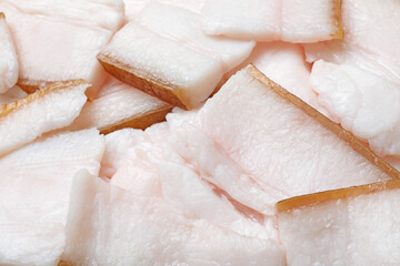Fototapeta na wymiar Pieces of tasty salt pork as background, closeup