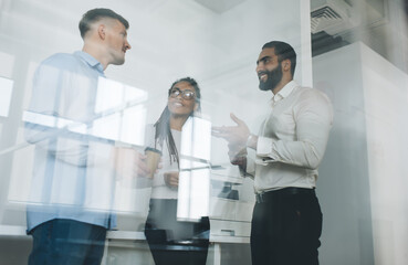 Successful young people collaborating with each other discussing creative ideas for development startup project, professional team of executive managers talking about business strategy of company