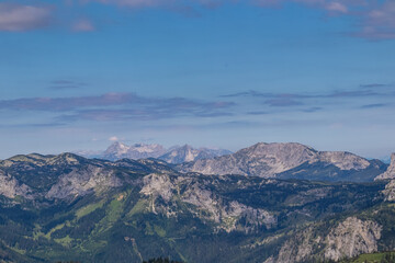 Panoramic view from Messnerin on Hochtor and alpine mountain chains in Styria, Austria, Hochschwab region. Hills overgrown with bushes, higher parts rocky. Summer day. Hiking in Alps, Tragoess