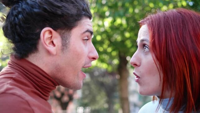 violent quarrel - young couple argues screaming and accusing each other