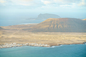 Views of the island of La Graciosa belonging to the group of Canary Islands, during a sunny day with beautiful clouds