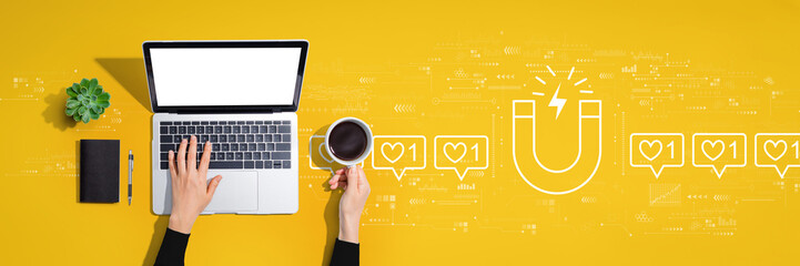 Get more likes concept with person using a laptop computer