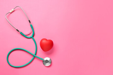 Fototapeta premium Stethoscope and red decorative heart on pink background, flat lay with space for text. Cardiology concept