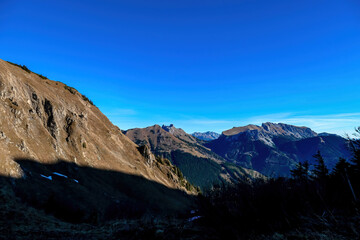 Panoramic view from mount Eisenerzer Reichenstein in Styria, Austria, Europe. Austrian Alps. Ennstal valley is partially still in the shadow. After sunrise. Hiking trail, Wanderlust