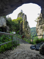 The entrance to the Grota Jaskinia Lokietka near the Skala Biala Reka (the White Hand rock) in the Ojcow National Park near Krakow, Lesser Poland, Poland. Cave. Jurassic Krakow-Czestochowa Upland