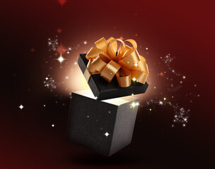 Beautiful gift box with magic light on color background
