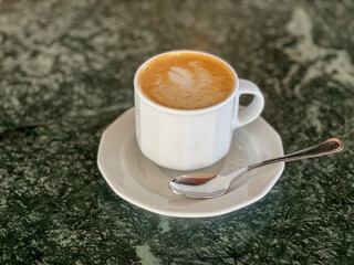 A delicious cup of cappuccino served on a cruise ship.