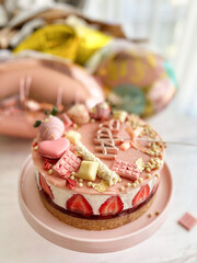 hands holding a cake