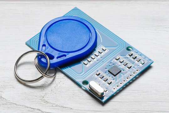 Magnetic key and module on the white background close up.