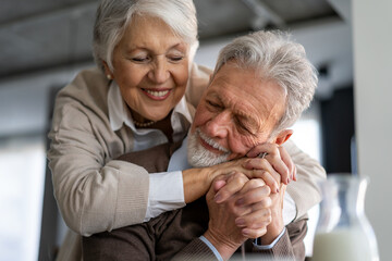 Elderly couple in love. Senior husband and wife hugging and bonding with true emotions