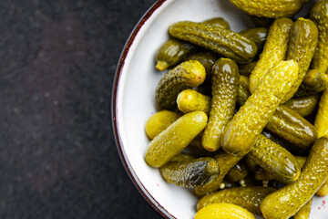 gherkins salted cucumbers pickled vegetable fresh portion healthy meal food diet snack on the table copy space food background 