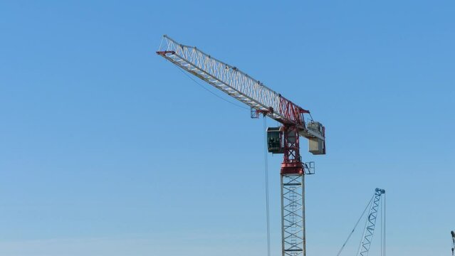 construction crane is working on a construction site. construction of business centers and residential apartments