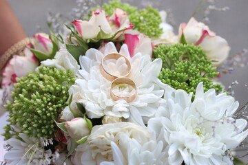 wedding rings on flowers. wedding bouquet.marriage