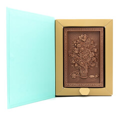 Fototapeta premium Three-dimensional drawing of flowers on chocolate in a gift box