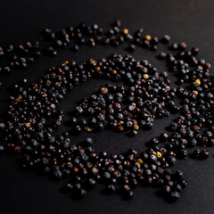 Dru juniper berries on the black background