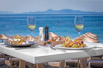 Table in the restaurant with mediteranina food near the sea