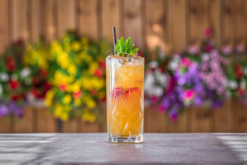 Summer Cocktail on a bar on a floral background