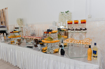 Different fresh fruits on wedding buffet table. Wedding reception catering table with different fruits. Catering table with different kind of fruits
