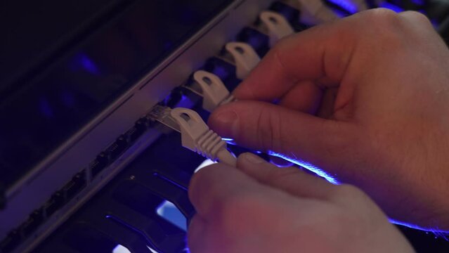 IT expert working with computer server network cable. Connectivity, Internet, technician, installing.