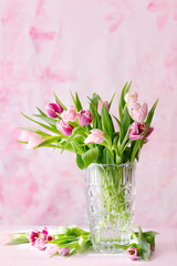 spring tulips on pink background. Greeting card for mothers day