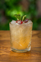 Cocktail with fruit on wooden table