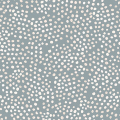 Seamless minimalistic pattern on a gray background with polka dots. For textiles, wallpaper, wrapping paper, children's clothing, postcards, website design.