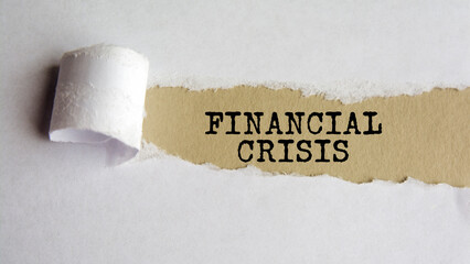 financial crisis. text on brown paper under a torn white paper sheet, business concept