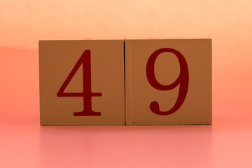 Numbers or dates on wooden cubes, forty-nine