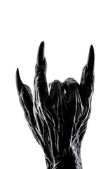 Creepy monster hand showing rock or devil horns gesture isolated on white with clipping path