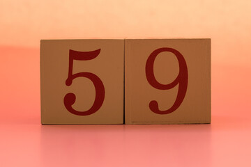 Numbers or dates on wooden cubes, fifty-nine