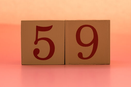 Numbers or dates on wooden cubes, fifty-nine