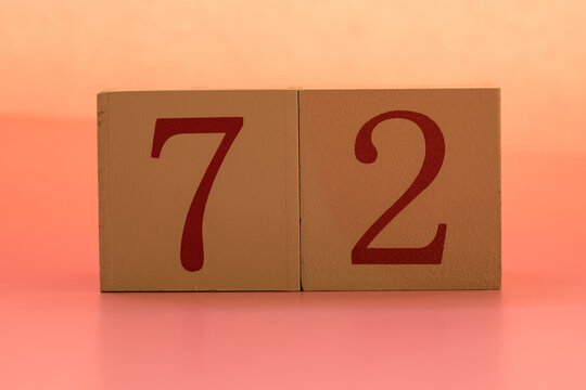 Numbers or dates on wooden cubes, seventy-two