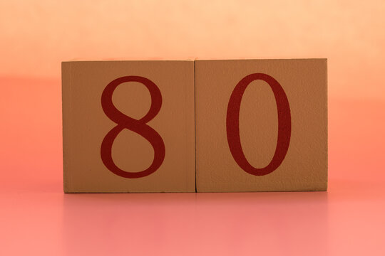 Numbers or dates on wooden cubes, eighty
