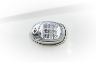 Boat board LED navigation light in stainless housing, with glass, side upper view, isolated on white