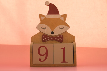 Numbers or dates on wooden cubes with fox, ninety-one