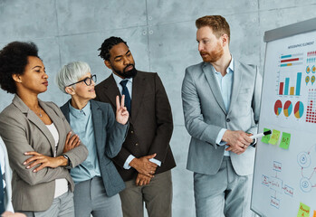 young business people meeting office teamwork group whiteboard presentation seminar senior mature colleague together