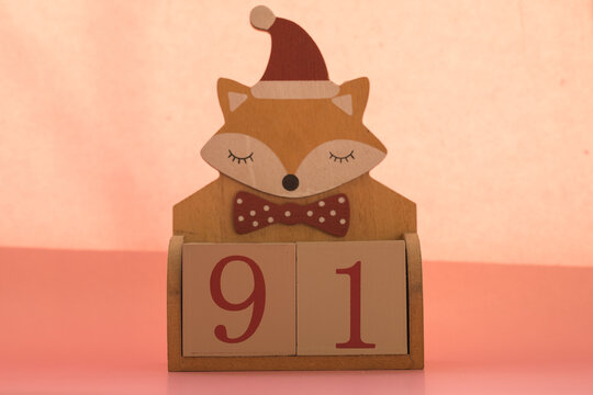 Numbers or dates on wooden cubes with fox, ninety-one